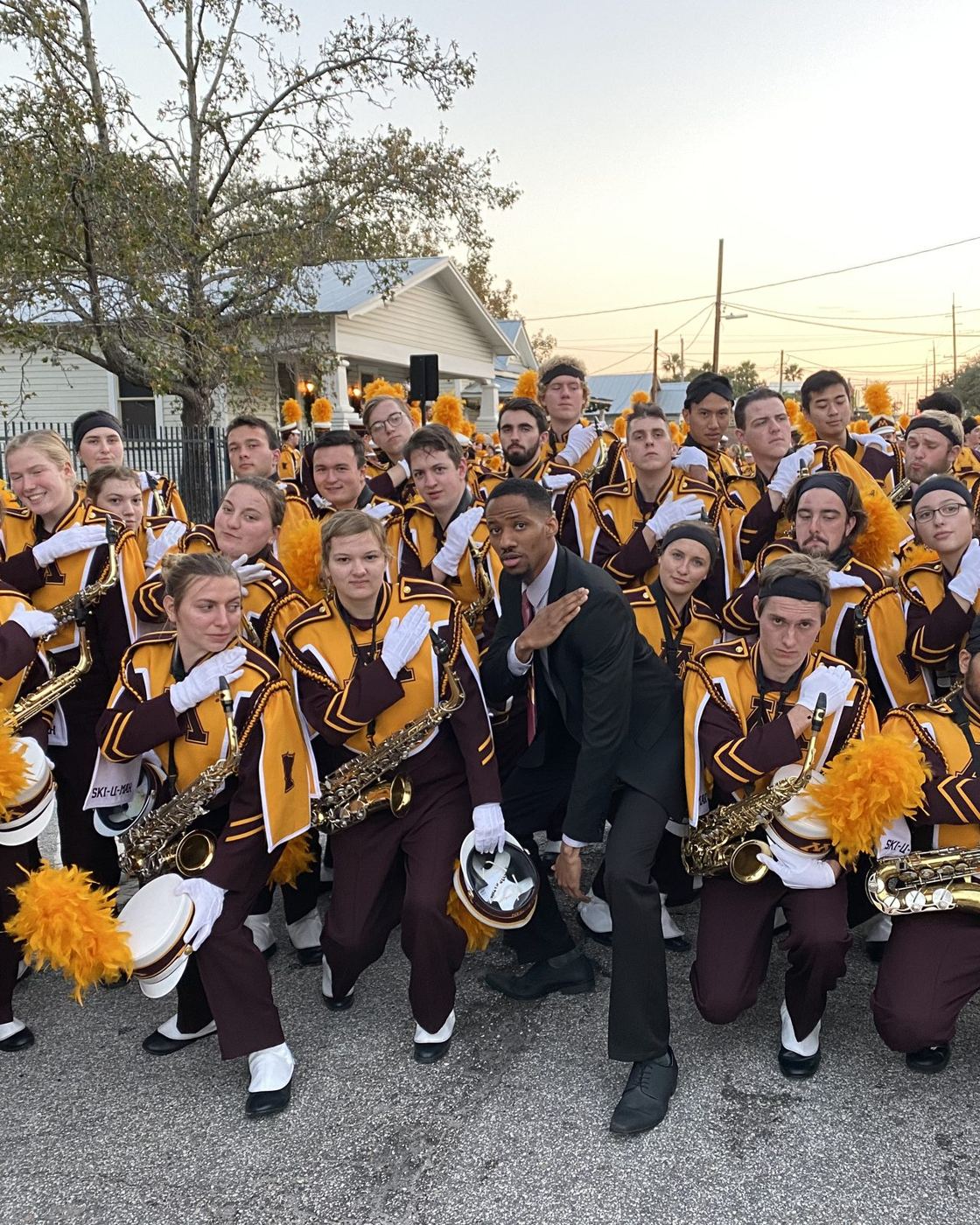 Daniel James Felton with the saxophone section at a bowl game