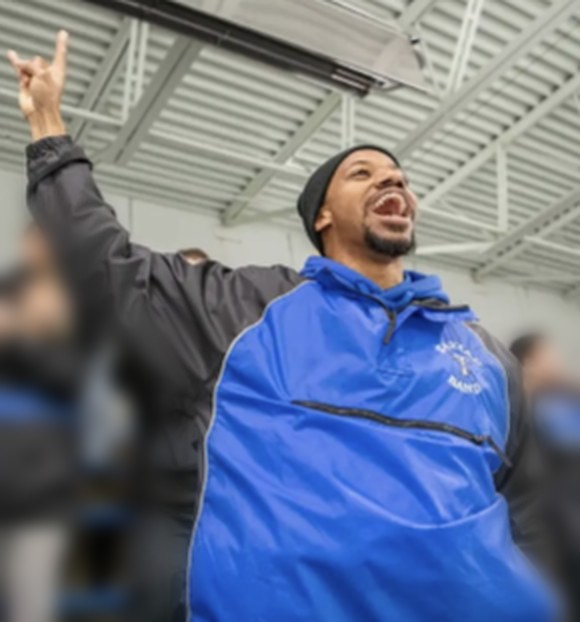 Daniel James Felton cheering with the Tartan pep band